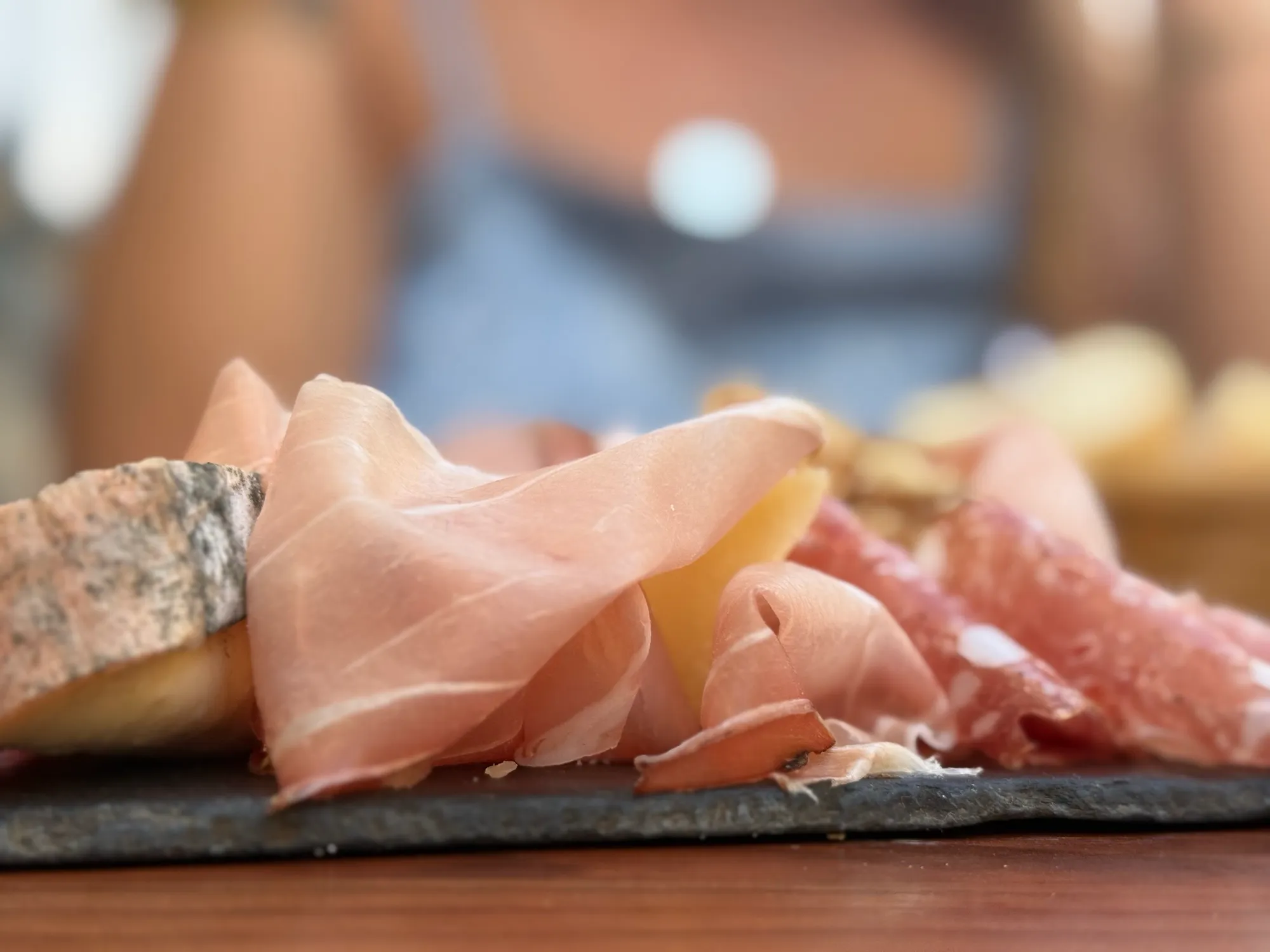 Close-up of sliced jambon and charcuterie on a board